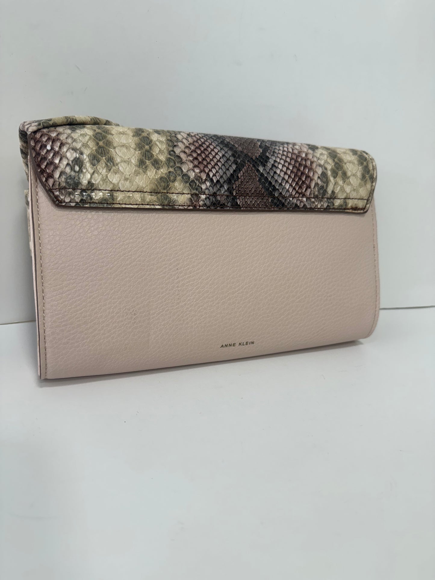 Pink snake textured clutch with bow